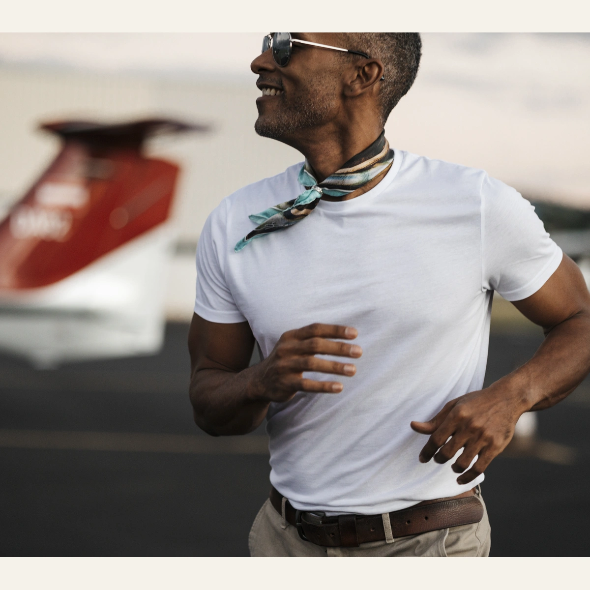 Silk scarf 45 Taporo 33 by Maison DEVIENNE worn on the neck