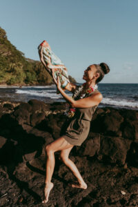 Luxury silk scarf worn in motion in a natural landscape